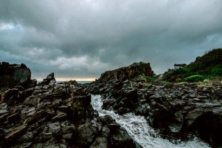 Rocky River Under Cloudy Sky photo