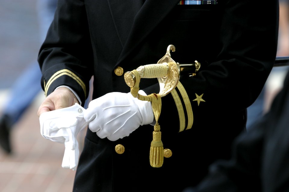 Man In Black Suit Wearing Gloves