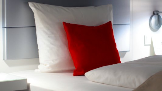Red And White Bed Pillows photo