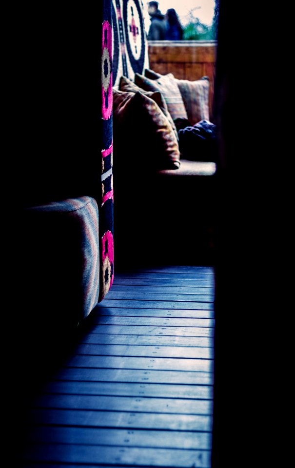 Close Up Photograph Of Sofa Chair Near Round Ottoman