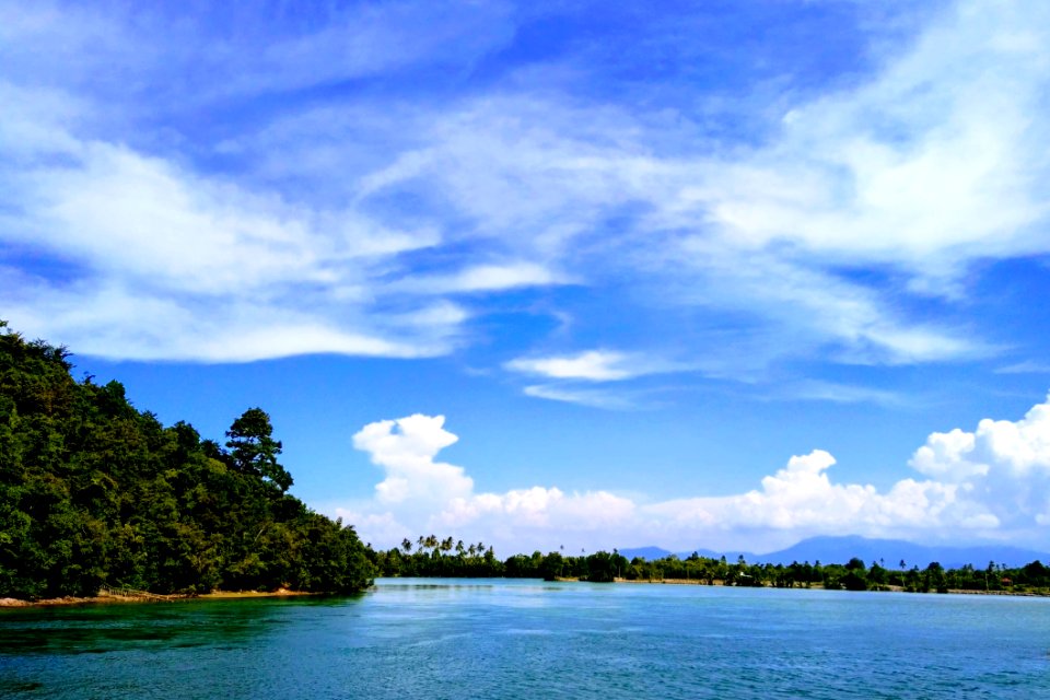 Ocean Under Blue Sky And White Clouds