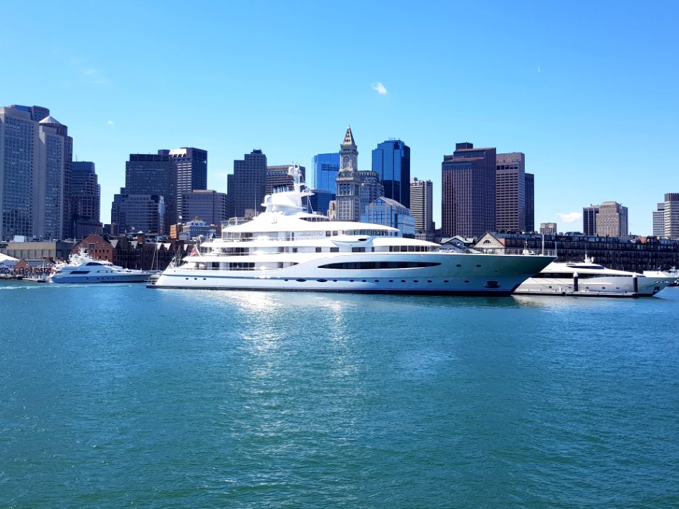 White Ship In A Distance Of Skyline Buildings