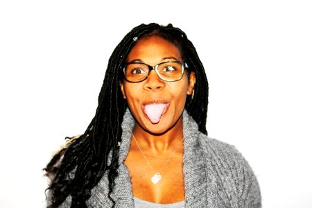 Photography Of Woman Showing Her Tongue photo
