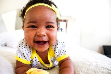 Baby Wearing White And Yellow Shirt photo