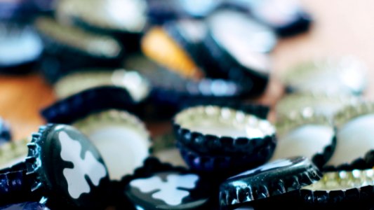 Close-up Photography Of Black Bottle Cap Lot photo