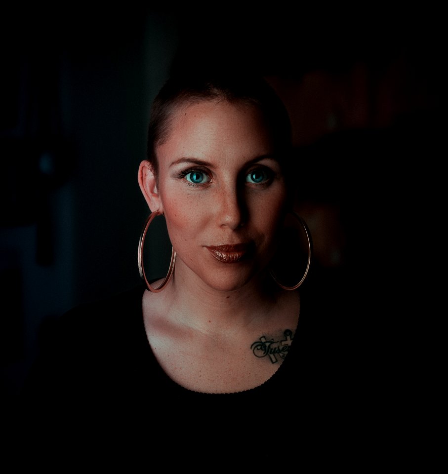 Woman Wearing Earrings And Black Shirt