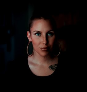 Woman Wearing Earrings And Black Shirt photo