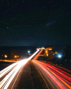 Timelapse Photography Of Car Passing By The Road During Nighttime photo
