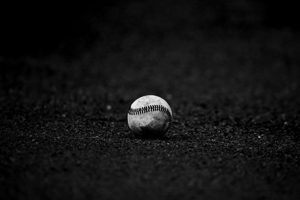 Selective Focus Grayscale Photography Of Baseball