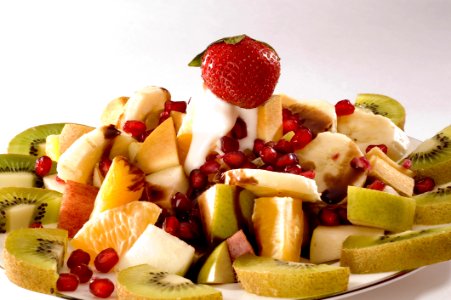 Strawberry With Sliced Kiwis And Fruits photo
