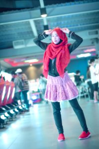 Woman In Red Head Scarf With Black Dress Shirt And Pink Skirt
