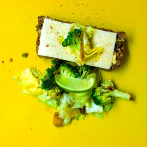 Photo Of Green Broccoli White Cheese And Green Cabbage On Yellow Surface