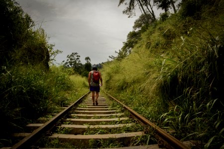 Man Walking In Train Railroad photo