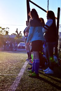 Women Wearing Pair Of Blue High-socks