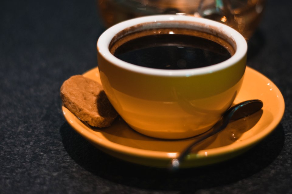 Coffee Filled Ceramic Teacup With Saucer