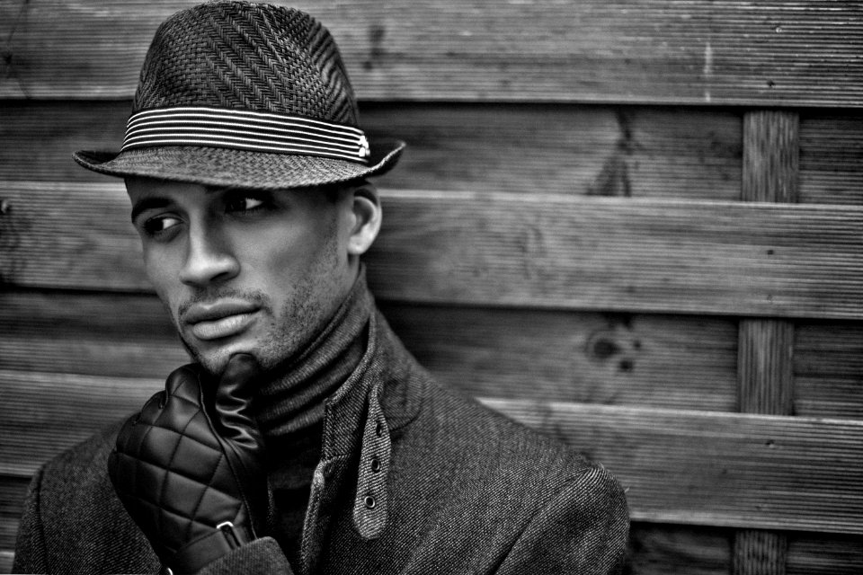 Man Wearing Black Hat And Gloves