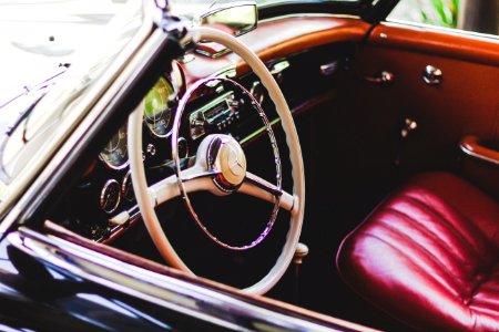 Photography Of Red Leather Vehicle Interior