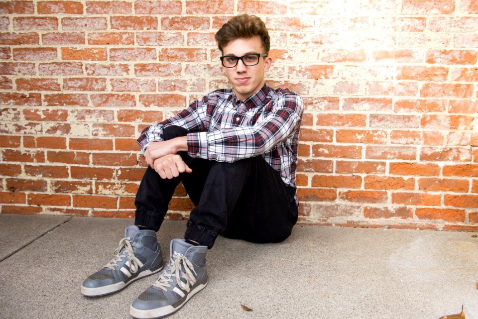 Man In Plaid Dress Shirt Sitting