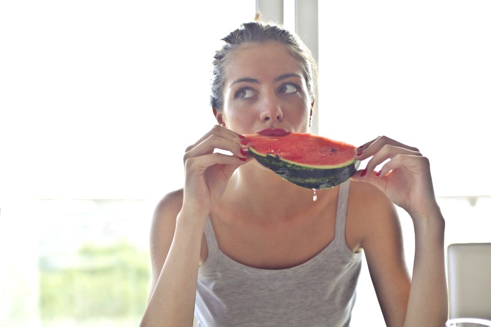 Woman In Gray Tank Top Holding Watermelon photo