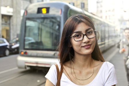 Woman In White Shirt With Eyeglasses Standing Near Train