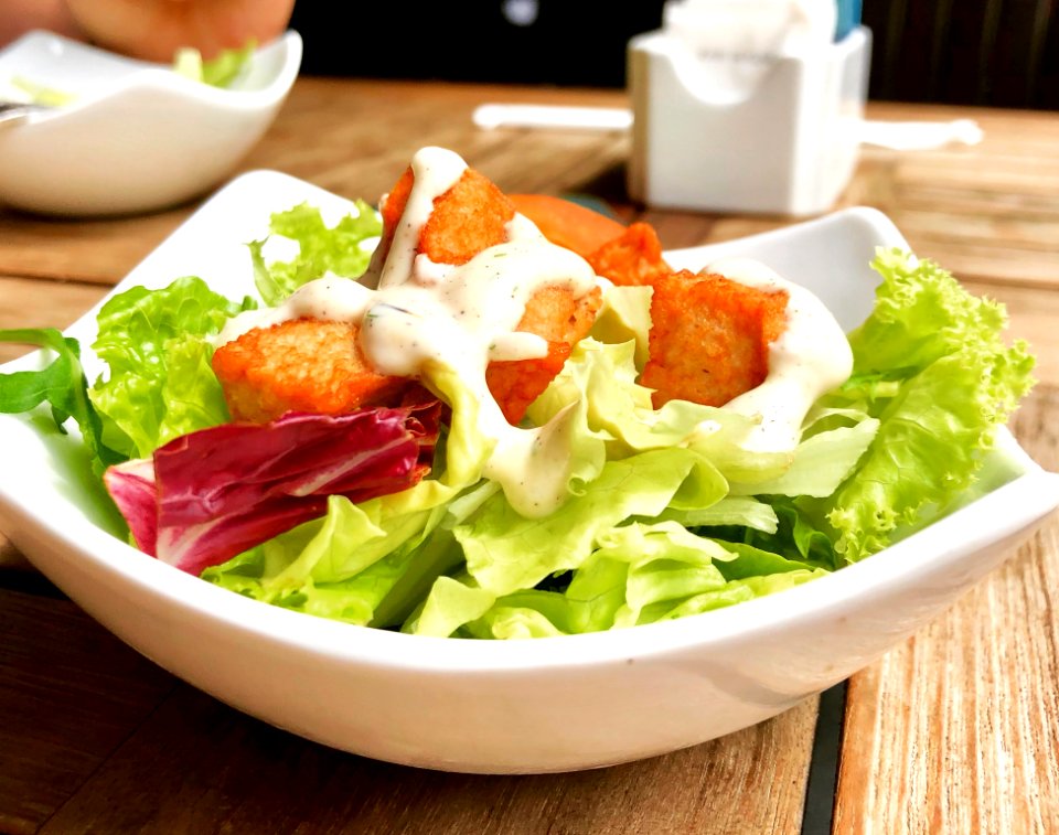 Vegetable Salad On Top Of White Ceramic Plate photo