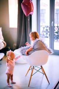 Baby And Girl Playing With Balloon