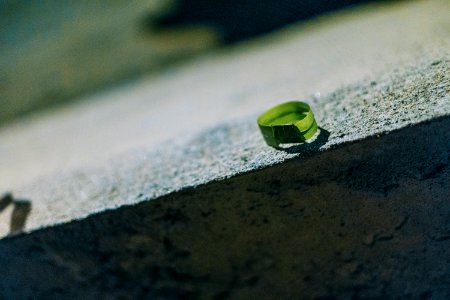 Photo Of Round Green Leaf On Gray Concrete Bench