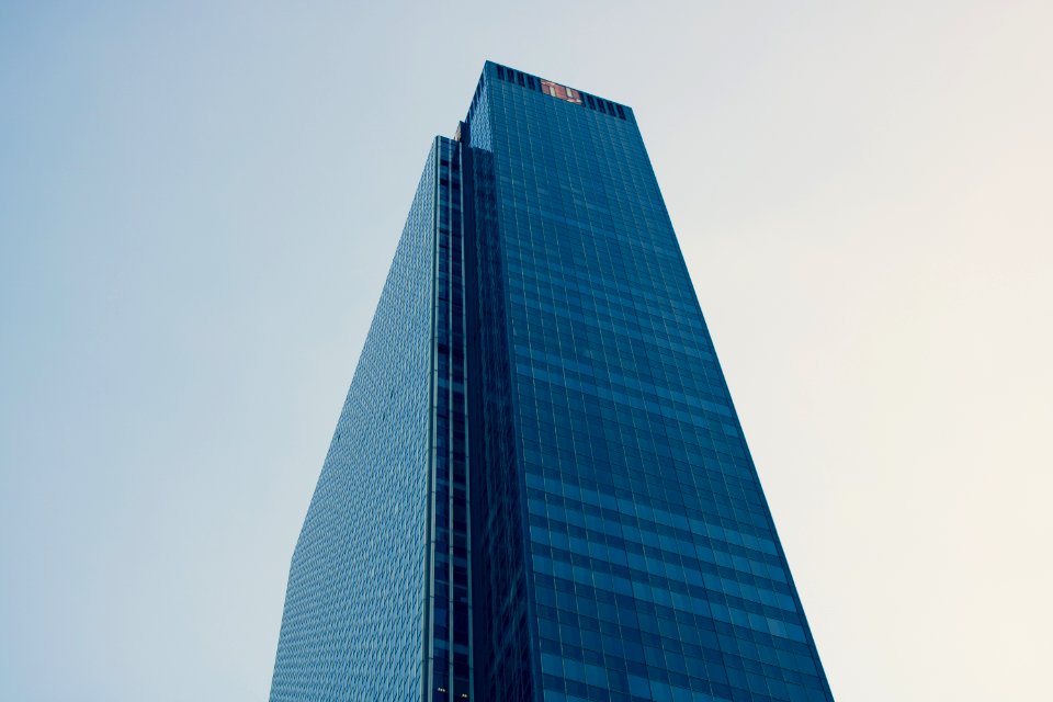 Low Angle Photography Of Curtain Building Under White Sky photo