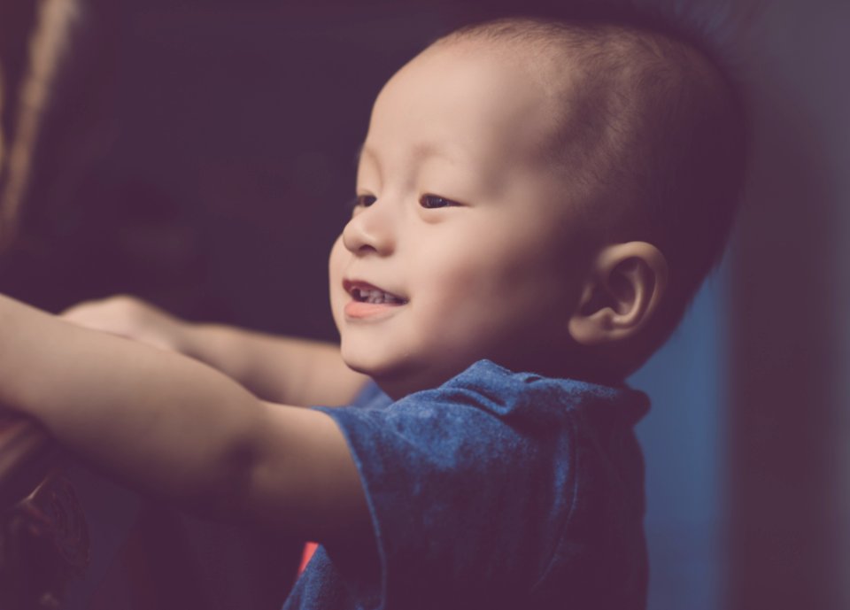 Close-Up Photography Of A Smiling Baby photo