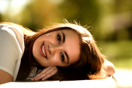 Close Up Photography Of Woman Laying On Table
