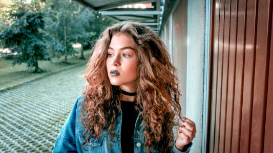 Women Wearing Blue Denim Jacket photo