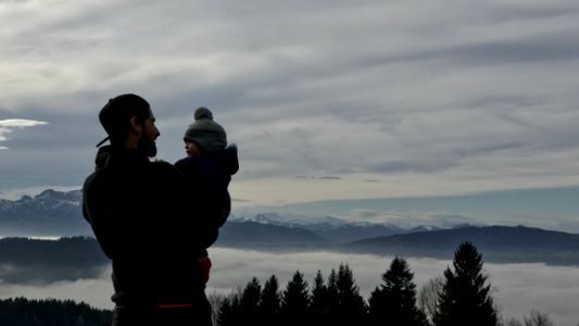 Man Holding A Baby Photo