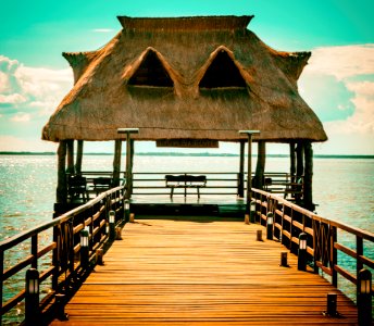 Brown Wooden Hut On Pier