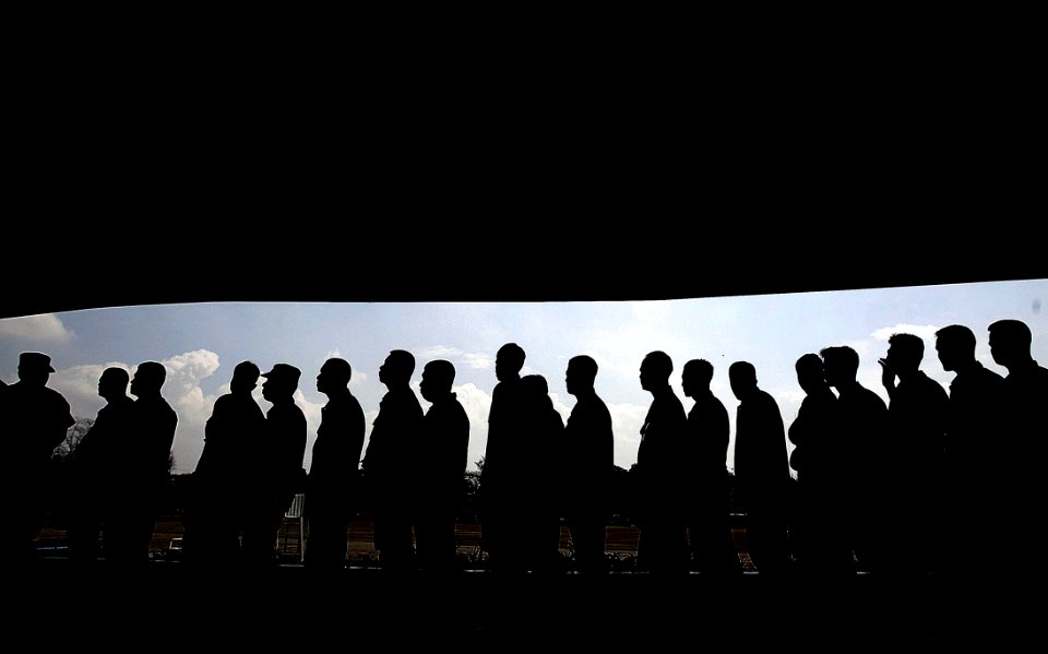 Group Of Men Forming A Libe