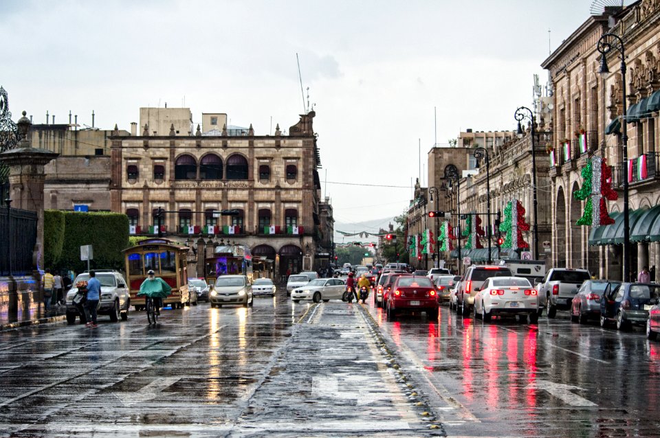 Cars And People On Rainy Day