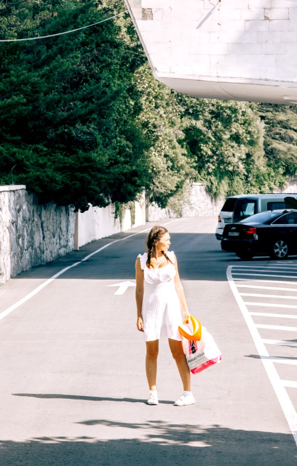 Woman Standing In The Middle Of The Road