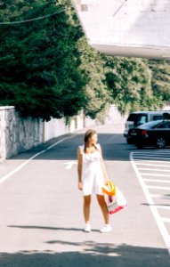 Woman Standing In The Middle Of The Road