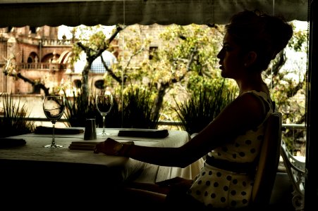 Photography Of A Woman In White And Black Dress Sitting photo