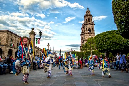 Group Of Performers Dancing Near Trees photo