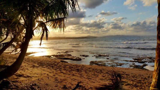 Landscape Photo Of Beach Under Partly Cloudy Skies