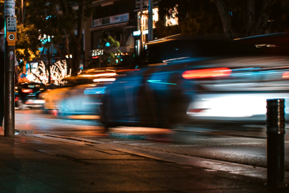 Time-lapse Photography Of Silver Car Passed By On Road photo