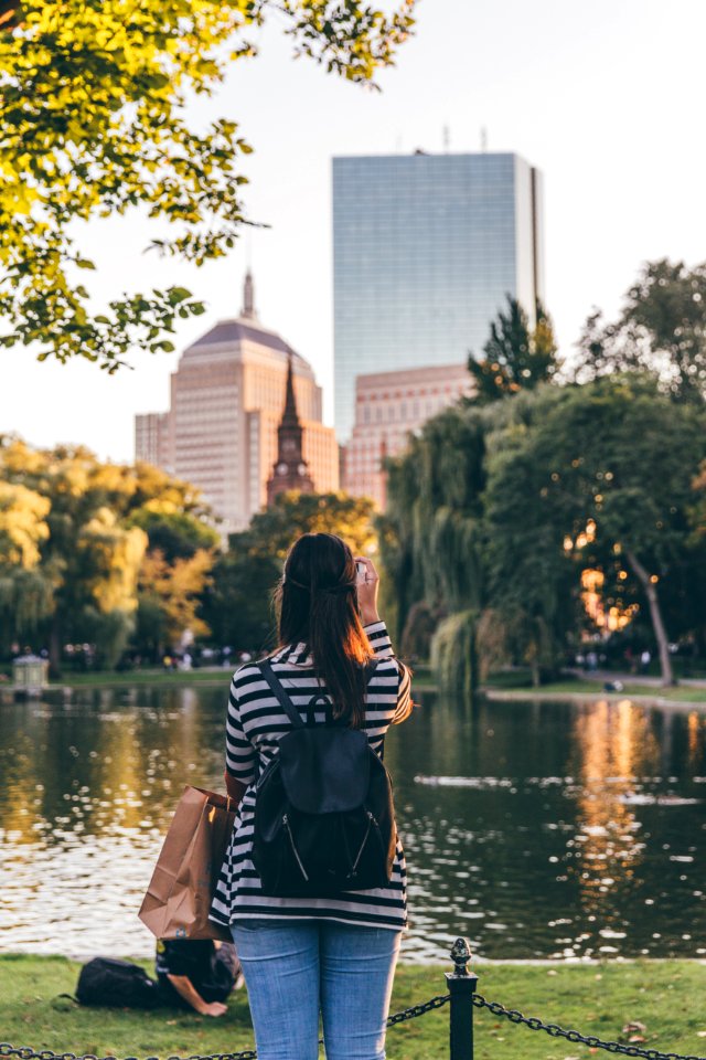 Photo Of Woman Standing Near Body Of Water photo