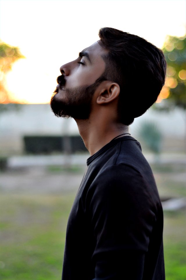 Side View Photography Of Man While Closing His Eyes
