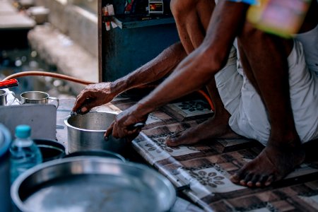 Person In White Shorts Holding Stainless Steel Casserole photo