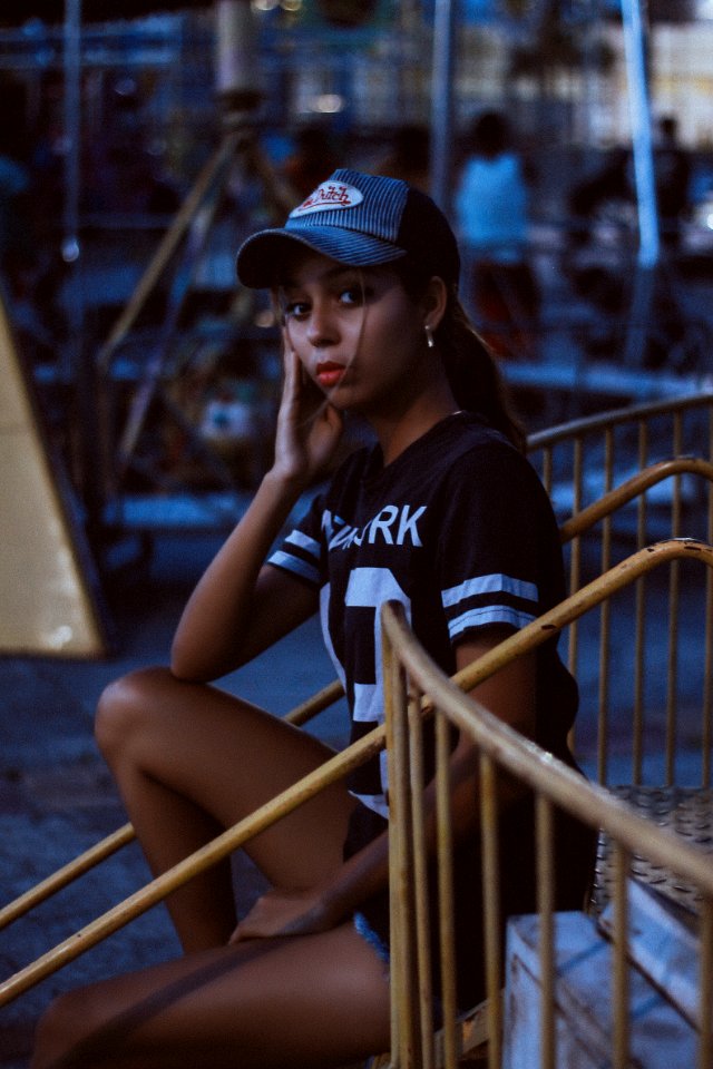 Woman In Black And White T-shirt And Von Dutch Cap