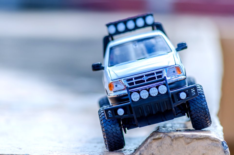 Silver Ford Toy Car On The Ground