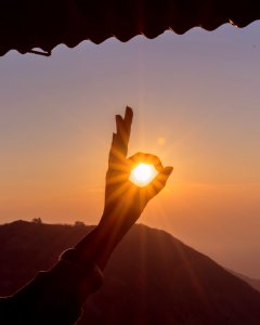 Photography Of Hand During Sunset photo