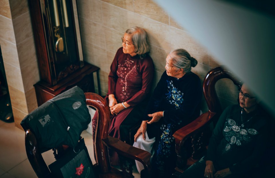 Photography Of Three Old Women Sitting On Chair