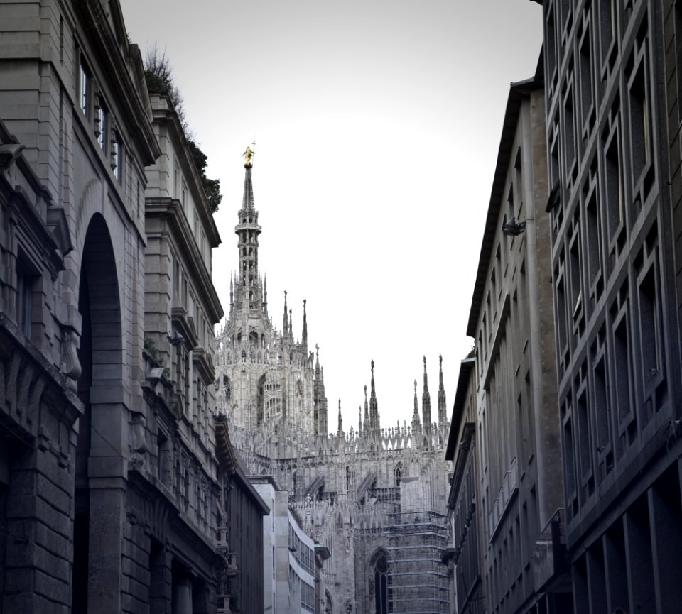 Grayscale Photo Of Alley With Tower Background photo