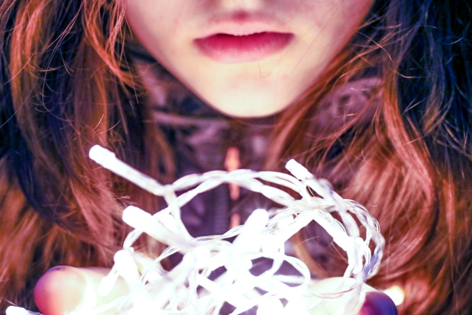 Woman Holding String Light
